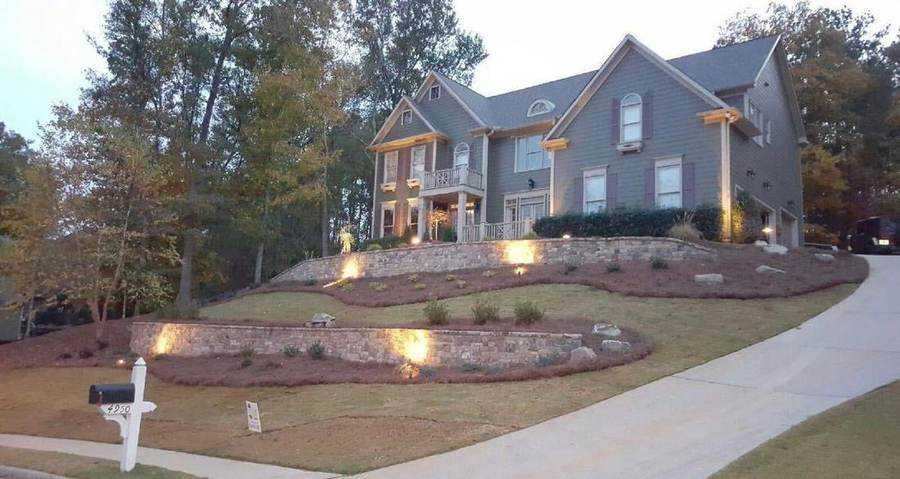 Professional landscaping with night lighting by New Life Outdoors